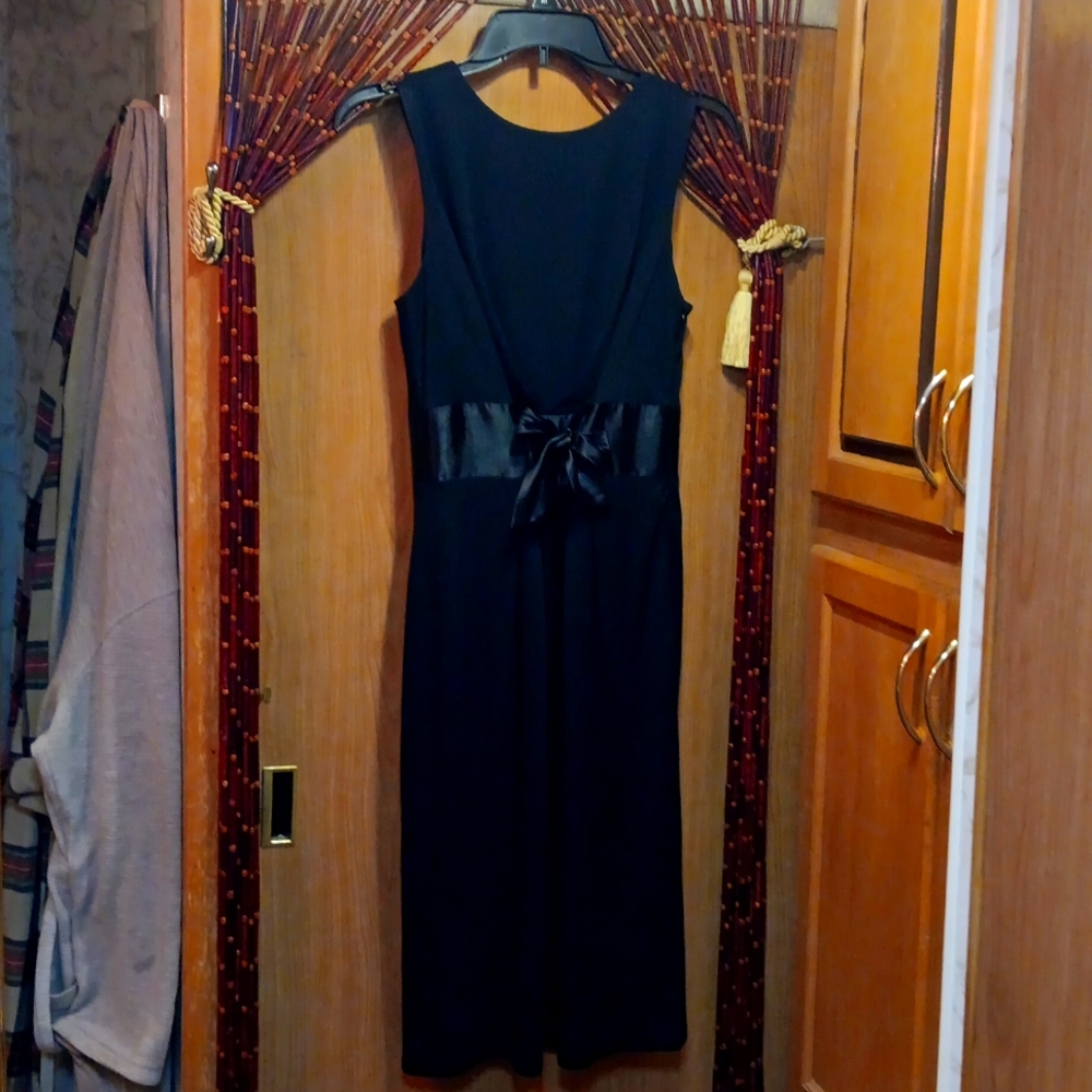 A gently worn size 8 little black dress by David Meister.